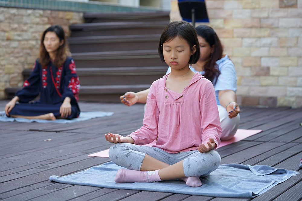 student in meditation